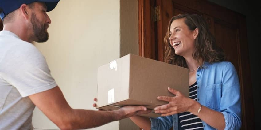 courier giving parcel to the customer